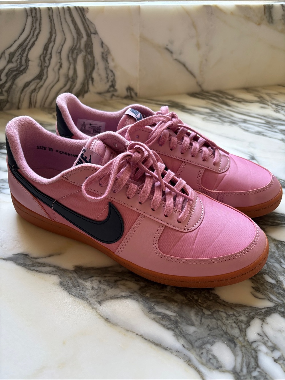 Nike Pink Low-Top Sneakers with Black Swoosh and Gum Sole
